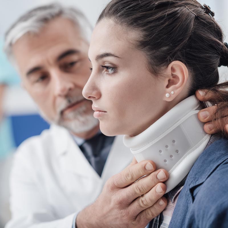 McLain-Insurance-Workers-Comp-Insurance McLain Insurance Agency | Chesterfield, SC | workers comp insurance, young woman with neck injury getting checked by doctor